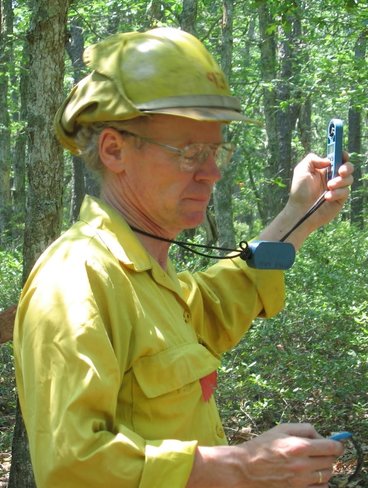 Researcher outside preparing to begin a prescribed burn