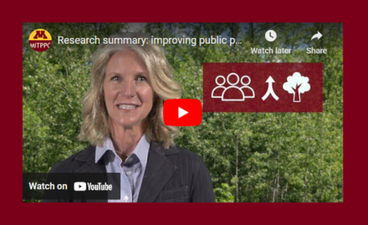 A screenshot of the research summary video "improving public perception of forest management in response to emerald ash borer." In the screenshot, a woman with blond, shoulder-length hair and wearing a suitcoat stands in front of a copse of trees.