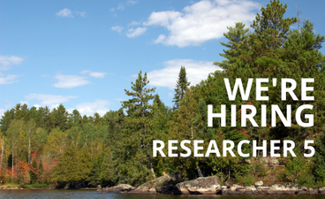 Over a photo of a lakeshore surrounded by a dense forest is the text, "We're hiring a researcher 5."