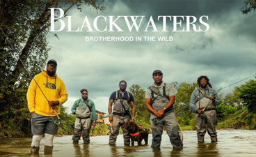 The Blackwaters film poster. Five Black men wearing waders and holding fishing rods stand in a river. The sky above them is cloudy. The name of the film is written on the top followed by it's tag line, "Brotherhood in the Wild."
